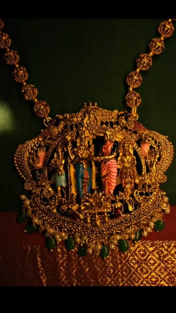 Temple pendant necklace with emerald drops